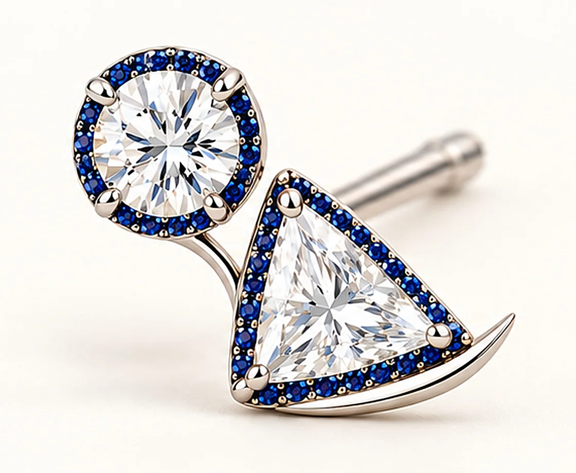 The ittwoy earring in white gold: a round diamond and a triangle diamond, each ringed in sapphires